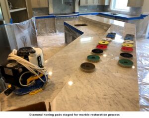 Diamond honing pads used for marble restoration and polishing during natural stone refinishing.